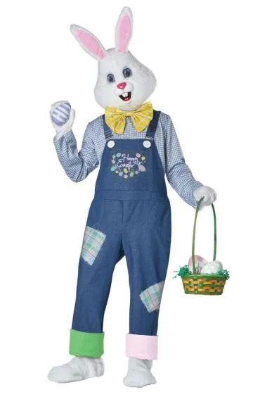 Person dressed in a full-body Easter Bunny costume featuring a white bunny head, denim overalls with pastel patchwork, a yellow bow tie, and holding a basket of Easter eggs.