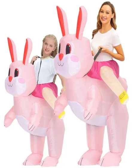 Inflatable pink bunny ride-on costume featuring two people appearing to ride oversized cartoon-style rabbits with rosy cheeks, long ears, and attached faux legs for a fun illusion.